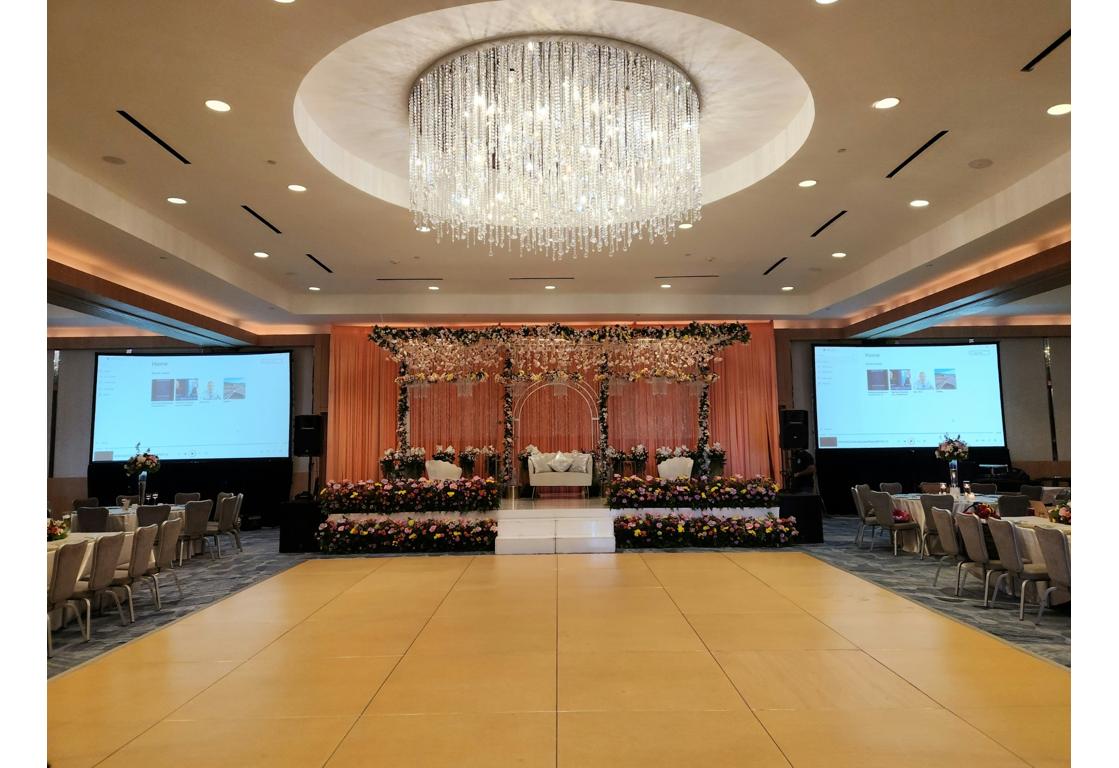 ACD technician adjusting projector at event