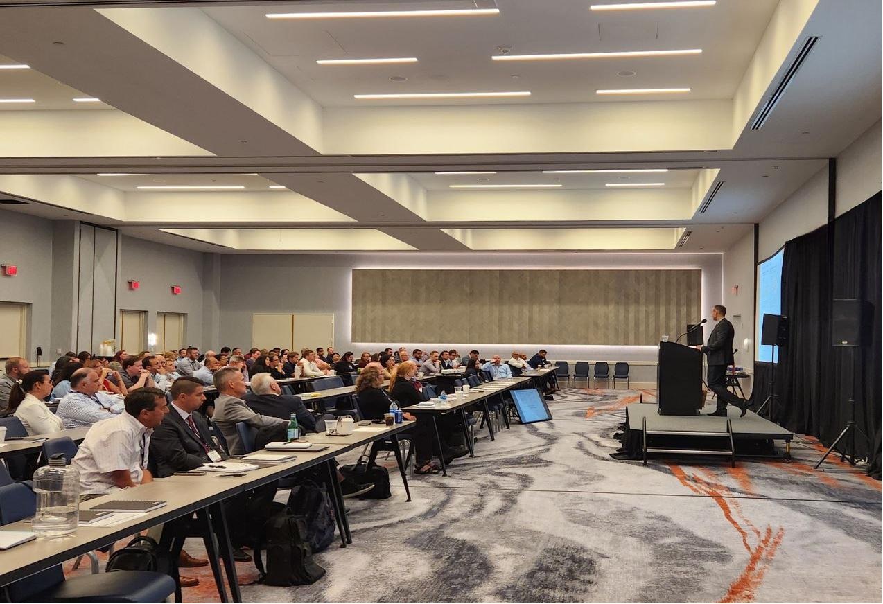 ACD technician adjusting projector at event